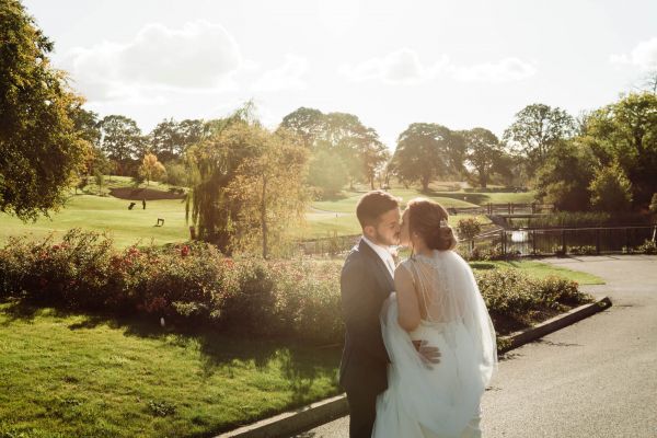 Couple Kissing By Lake